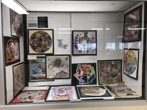 A display of collages from Mrs. Roman’s Drawing and Painting classes. Students were given base paper and any other supplies they desired and given free reign to create a collage. Photo courtesy of Becky Wood