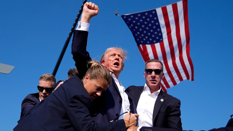 Donald Trump pumps his fist in the air after narrowly avoiding death after his failed assassination attempt at his campaign rally. Saturday, July 13, 2024, in Butler, PA.